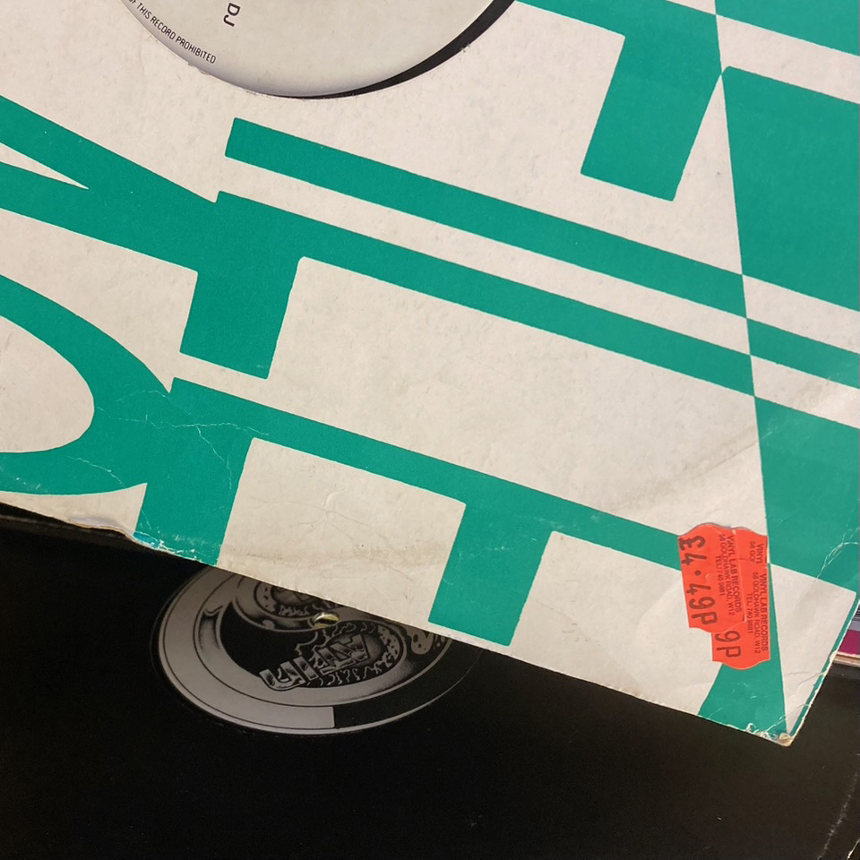 Green and white record sleeve. Orange price tag.