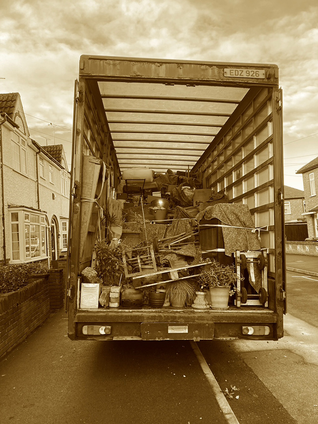 Back of a moving truck. Yellow filter.